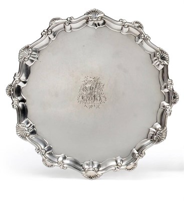 Lot 1042 - A George III Silver Salver, Elizabeth Cooke, London 1766, shaped circular with scroll and shell...