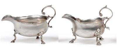 Lot 1044 - A George II Silver Sauceboat, David Hennell I, London 1746, with undulating rim, leaf sheathed...