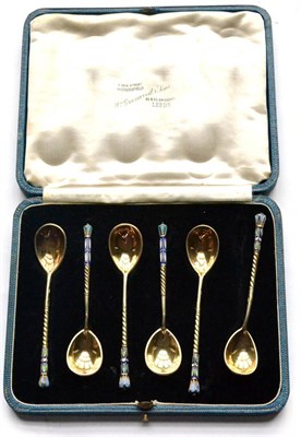 Lot 1077 - A Set of Six Russian Silver Gilt and Enamel Coffee Spoons, left facing Kokoshnik mark, other...