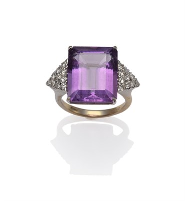 Lot 1117 - An 18 Carat White Gold Amethyst and Diamond Ring, the baguette cut amethyst flanked by a triangular