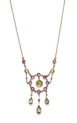 Lot 1133 - A Peridot, Seed Pearl and Tourmaline Necklace, circa 1900, of typical style, set with peridot,...