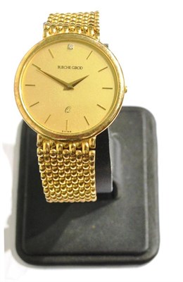 Lot 1148 - A 9ct Gold Wristwatch, signed Bueche Girod, circa 1990, quartz movement, champagne coloured...