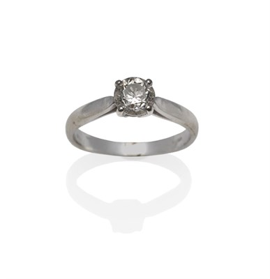 Lot 1153 - An 18 Carat White Gold Diamond Solitaire Ring, a round brilliant cut diamond in a four claw...