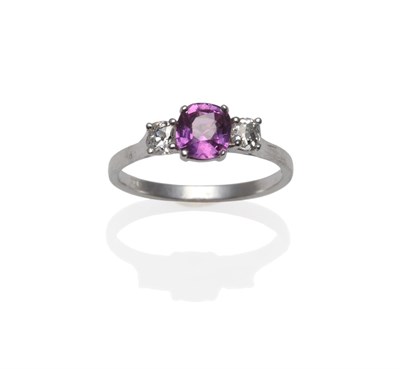 Lot 1157 - An 18 Carat White Gold Pink Sapphire and Diamond Ring, the cushion shaped pink sapphire with an old