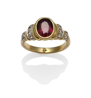 Lot 1175 - A Garnet and Diamond Ring, the oval cut garnet in a yellow rubbed over setting, with curved stepped