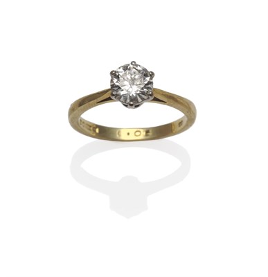 Lot 1198 - An 18 Carat Gold Diamond Solitaire Ring, the round brilliant cut diamond in a white six claw...