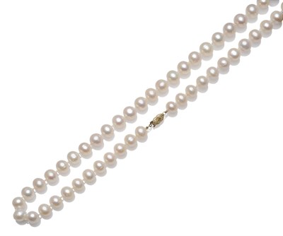 Lot 1200 - A Cultured Pearl Necklace, sixty-three button shaped cultured pearls knotted to a pierced...