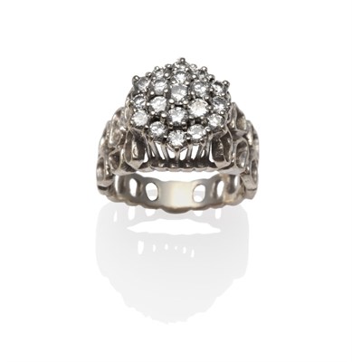 Lot 1201 - A Diamond Cluster Ring, the round brilliant cut diamonds in white claw settings on a...