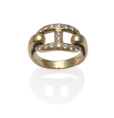 Lot 1202 - An 18 Carat Gold Diamond Set Ring, by Hermes, a central 'bit' form inset with round brilliant...