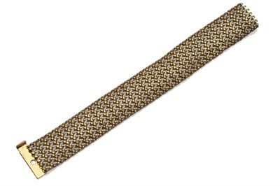Lot 1207 - An 18 Carat Gold Two Colour Bracelet, of woven effect, comprising textured white and grooved yellow