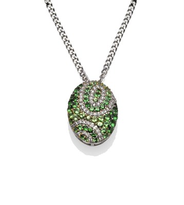 Lot 1216 - A Green Garnet and Diamond Pendant on a 9 Carat Gold Chain, the oval pendant set with various...