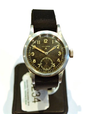 Lot 1234 - A Military Wristwatch, signed Record, circa 1945, lever movement, black dial with luminous...