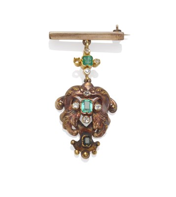Lot 1238 - An Emerald and Diamond Brooch, a plain bar suspends a quatrefoil emerald and diamond cluster, to an