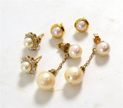 Lot 1251 - Three Pairs of Cultured Pearl Earrings, including a pair of drop earrings, a pair of stud earrings