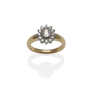 Lot 1261 - An 18 Carat Gold Diamond Cluster Ring, an oval cut diamond within a border of round brilliant...
