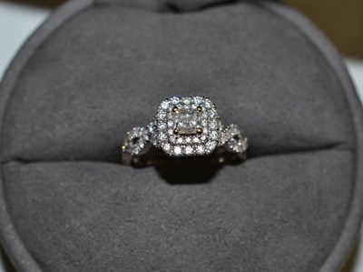 Lot 1209A - An 18 Carat White Gold Diamond Cluster Ring, Vera Wang for Goldsmiths, a central princess cut...