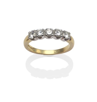 Lot 2006 - An 18 Carat Gold Diamond Five Stone Ring, the round brilliant cut diamonds in white claw...