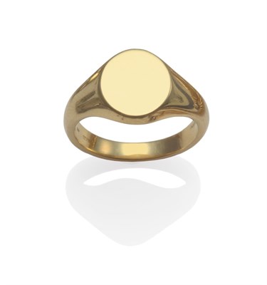 Lot 2011 - An 18 Carat Gold Signet Ring, the plain polished oval head to integral shank, finger size X