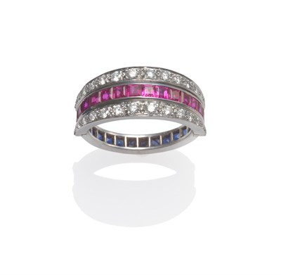 Lot 2028 - An 18 Carat White Gold Diamond, Sapphire and Ruby Eternity Ring, the eternity ring set with...