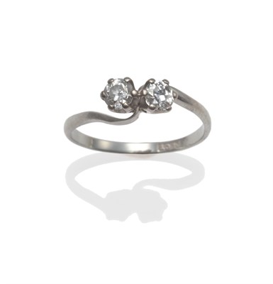 Lot 2031 - A Diamond Two Stone Twist Ring, the old brilliant cut diamonds in white claw settings, to...