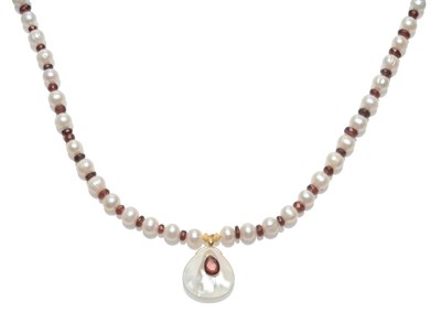 Lot 2062 - A Garnet and Cultured Pearl Necklace with Pendant Drop, the cultured pearls spaced with faceted...