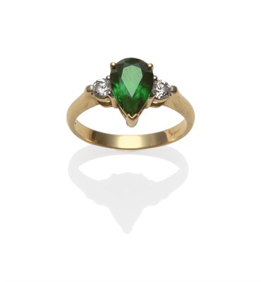 Lot 2067 - An 18 Carat Gold Green Garnet and Diamond Three Stone Ring, the pear cut green garnet flanked...