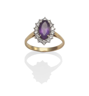Lot 2078 - An 18 Carat Gold Amethyst and Diamond Cluster Ring, a marquise cut amethyst within a border of...