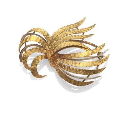 Lot 2082 - An 18 Carat Gold Spray Brooch, textured yellow ribbons spaced with knife edge white lengths,...