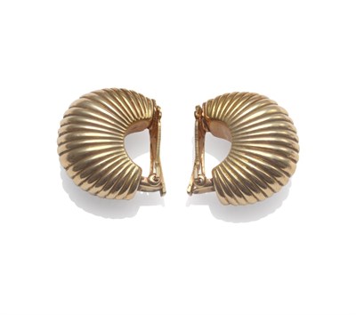 Lot 2084 - A Pair of Earrings, bearing Cartier signature, in shell-like form, with clip-on fittings, boxed