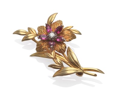Lot 2096 - An 18 Carat Gold Diamond and Ruby Floral Spray Brooch, a round brilliant cut diamond within a...