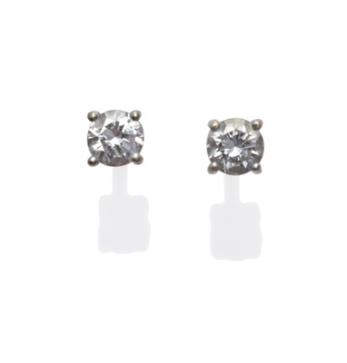 Lot 2107 - A Pair of 18 Carat White Gold Diamond Stud Earrings, the round brilliant cut diamonds in a four...