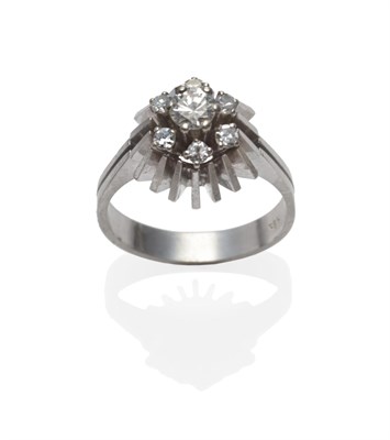 Lot 2110 - A Diamond Cluster Ring, a round brilliant cut diamond within a border of six eight-cut diamonds...