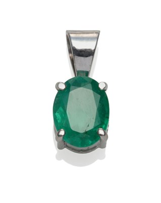Lot 2123 - An Emerald Pendant, the oval cut emerald in a white four claw setting on a tapered pendant...