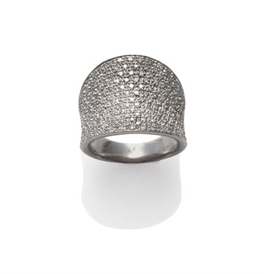 Lot 2139 - A 9 Carat White Gold Diamond Ring, the round cut diamonds pavé set in a concave form, total...