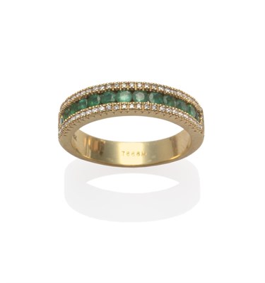 Lot 2152 - An Emerald and Diamond Ring, a row of round cut emeralds, channel set within a border of round...