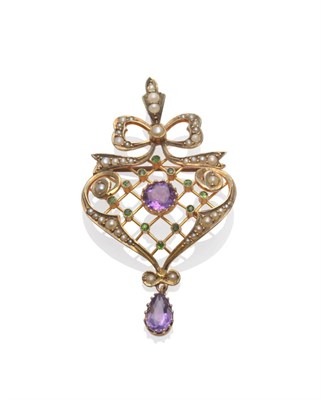 Lot 2161 - An Early 20th Century Brooch/Pendant, a bow surmounts a heart shape, knife edge wires in a grid...