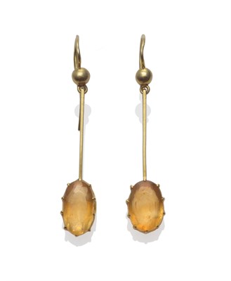 Lot 2169 - A Pair of Citrine Drop Earrings, the oval cut citrines in yellow claw settings, suspended on...