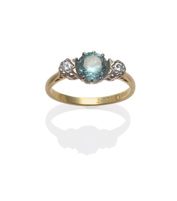 Lot 2171 - A Blue Zircon and Diamond Three Stone Ring, a round brilliant cut zircon in white claws with a...