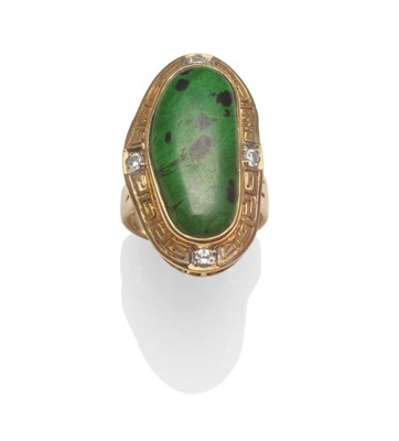 Lot 2003 - A Contemporary Ring, a dalmation stone of green body with black patches, centres a Greek-key...