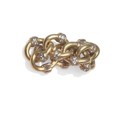 Lot 2023 - A Diamond Set Curb Link Ring, the yellow curb links with diamond set panels to the sides of...