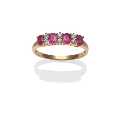 Lot 2029 - An 18 Carat Gold Ruby and Diamond Ring, four oval cut rubies alternate with pairs of brilliant...
