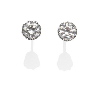 Lot 2033 - A Pair of Diamond Solitaire Earrings, the round brilliant cut diamonds in white claw settings,...