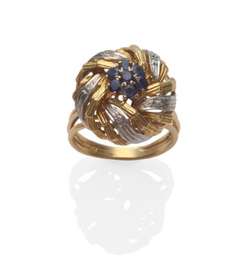 Lot 2056 - A Sapphire and Diamond Set Floral Cluster Ring, a cluster of sapphires in yellow claw settings,...