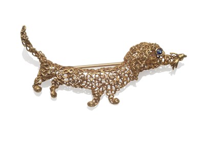 Lot 2062 - An 18 Carat Gold Dog Brooch, by Garrard & Co., in an openwork style, measures 6cm in length, in...