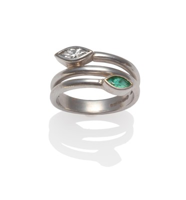 Lot 2082 - An 18 Carat White Gold Emerald and Diamond Ring, the coil effect ring with a marquise cut...