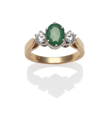 Lot 2088 - An 18 Carat Gold Emerald and Diamond Three Stone Ring, an oval cut emerald with a round...