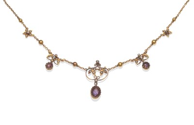 Lot 2095 - An Edwardian Amethyst and Seed Pearl Necklace, in foliate form, set with seed pearls and hung...