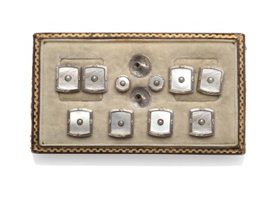 Lot 2106 - A Set of Dress Studs, mother-of-pearl body in decorative white frames, with a split pearl...