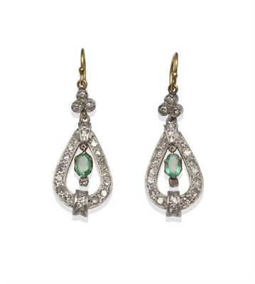 Lot 2110 - A Pair of Emerald and Diamond Drop Earrings, a trio of diamonds suspends a teardrop shape, set with