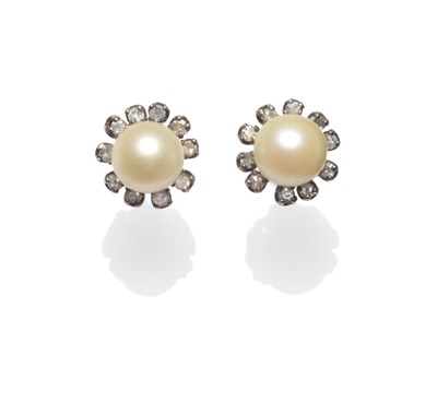 Lot 2123 - A Pair of Cultured Pearl and Diamond Cluster Earrings, each cultured pearl centres a spaced...